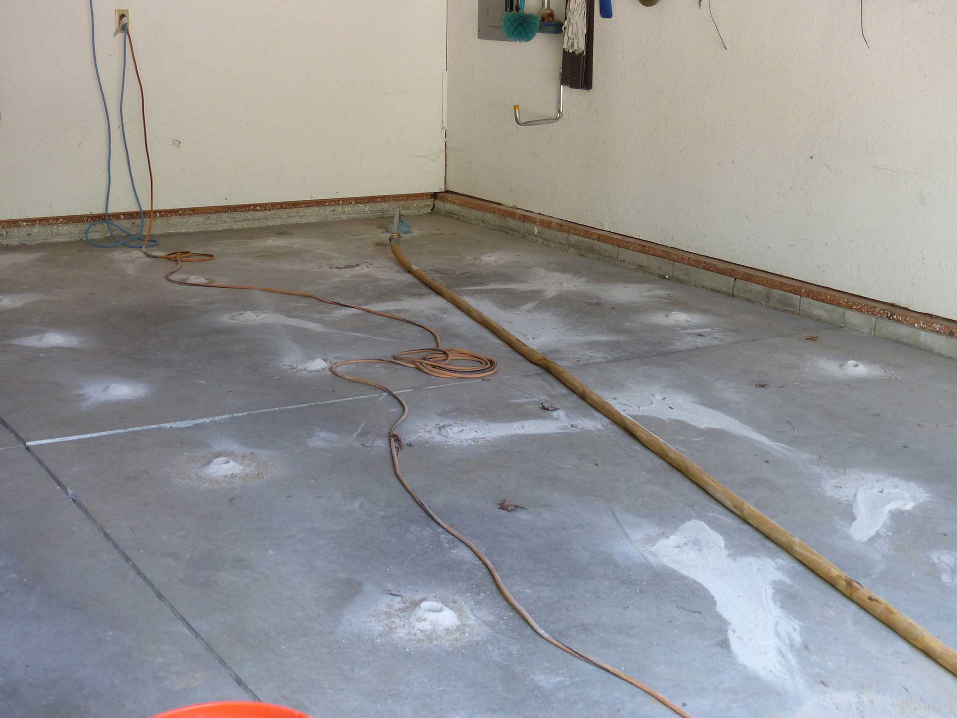 raising concrete slab in garage